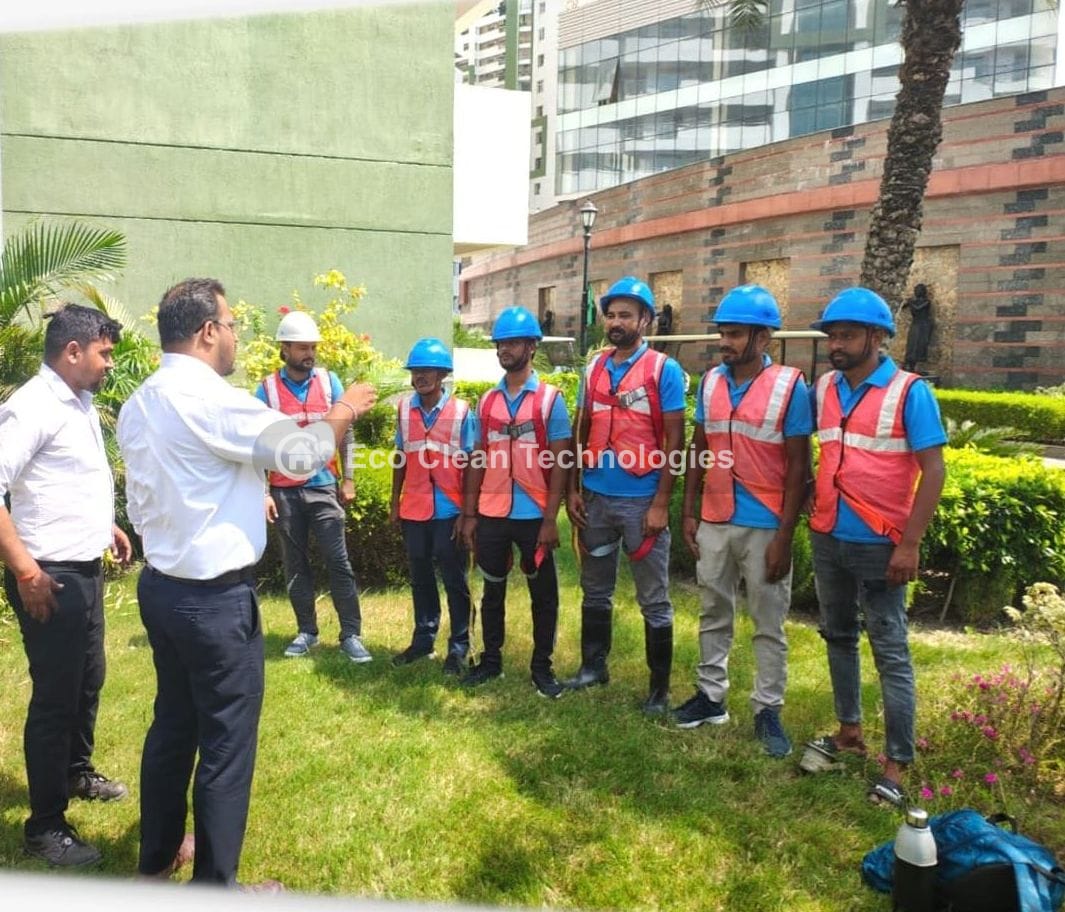 Eco Clean Technologies team safety briefing before underground tank cleaning